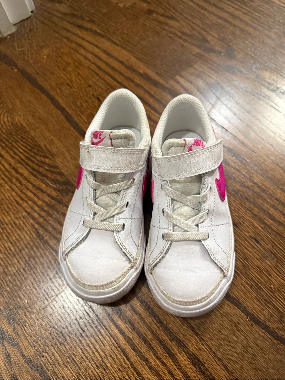 Nike Kids White Sneakers with Pink Swoosh